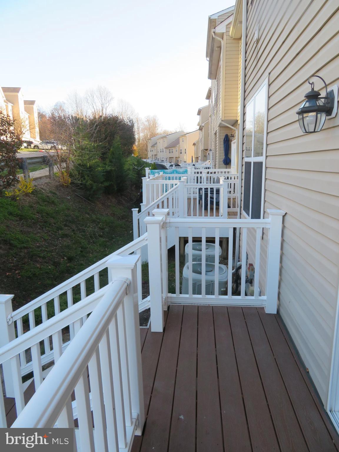 3700 Bedford Drive North Beach, MD 20714 - Photo 18 of 53 a view of a deck with wooden floor and fence