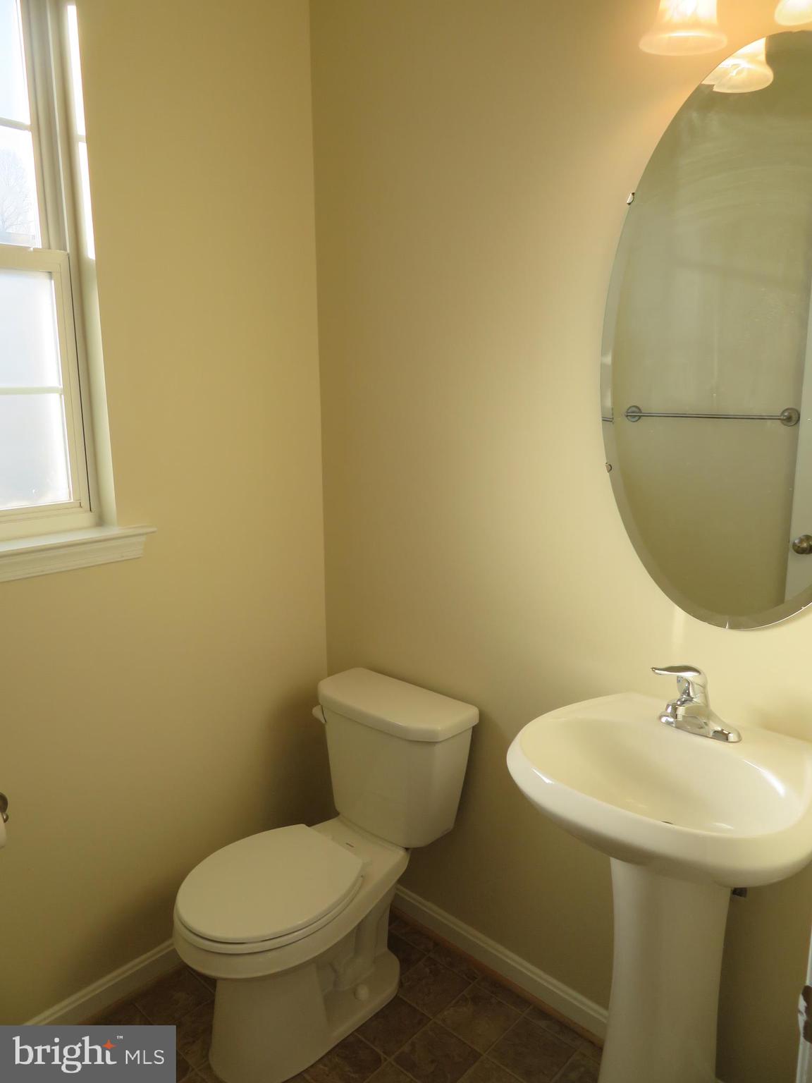 3700 Bedford Drive North Beach, MD 20714 - Photo 23 of 53 a bathroom with a sink and a toilet