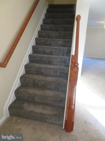 a view of a hallway with a room