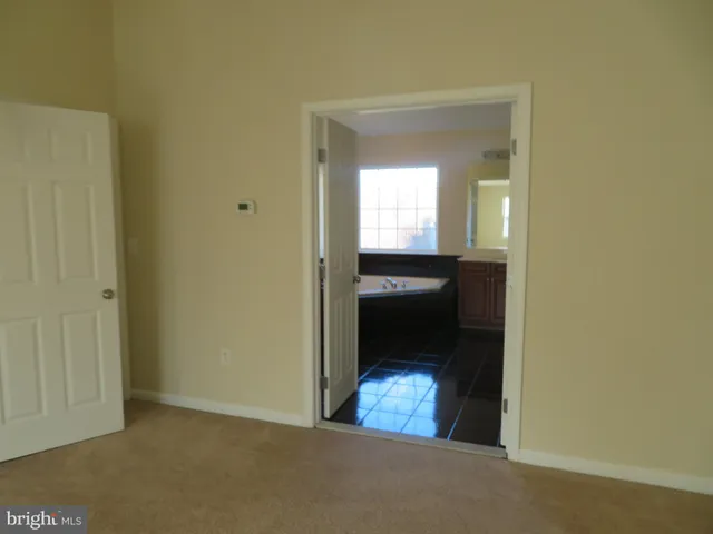 a bathroom with a bathtub and a sink