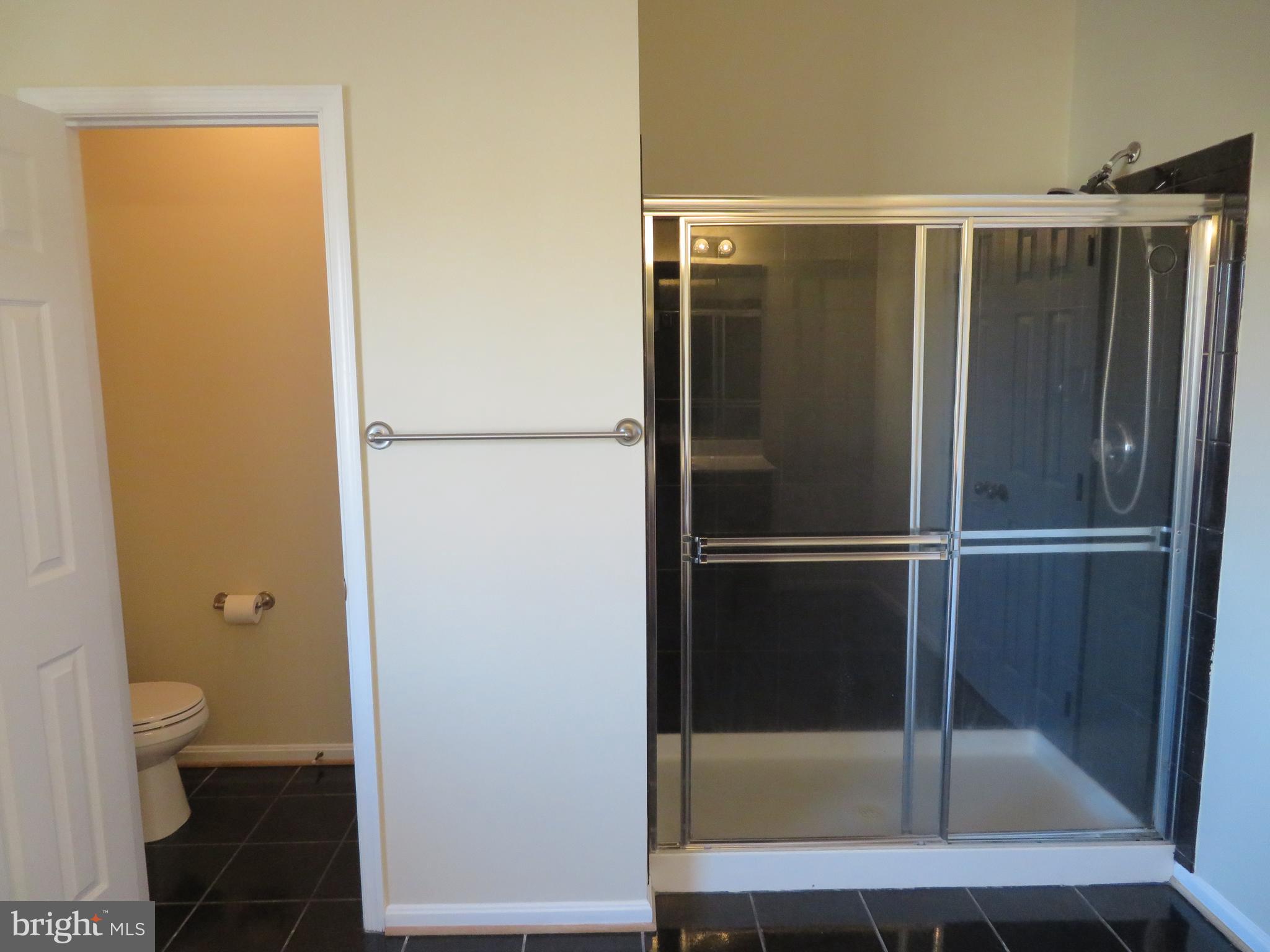 3700 Bedford Drive North Beach, MD 20714 - Photo 49 of 53 a bathroom with a glass shower door