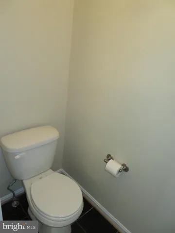 a view of a house with yard and sitting area