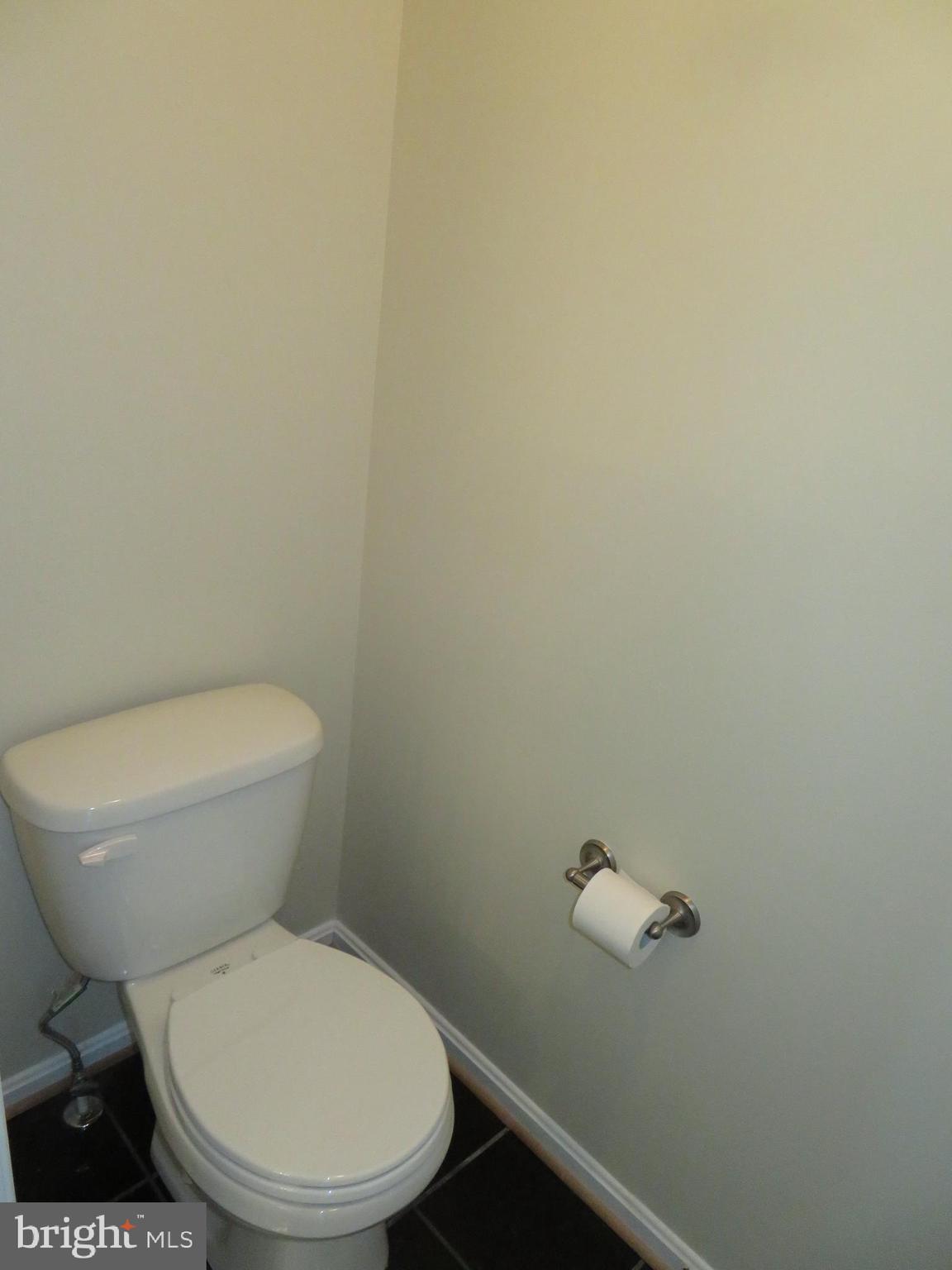 3700 Bedford Drive North Beach, MD 20714 - Photo 50 of 53 a white toilet sitting next to a white wall
