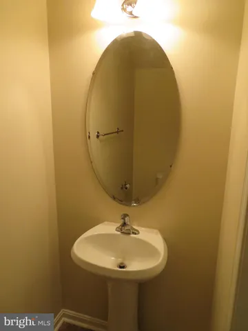 a bathroom with a sink and mirror