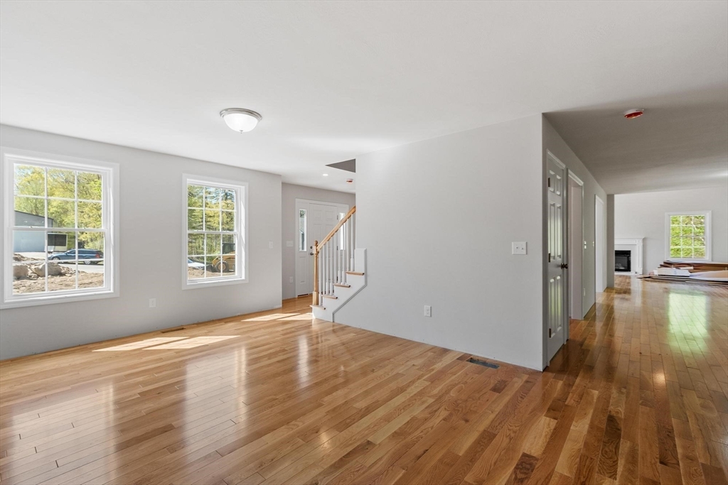 22 Benoit Avenue Pelham, NH 03076 - Photo 27 of 42 an empty room with wooden floor and windows