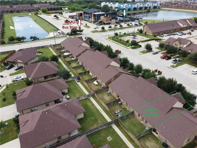 an aerial view of a city with lake view
