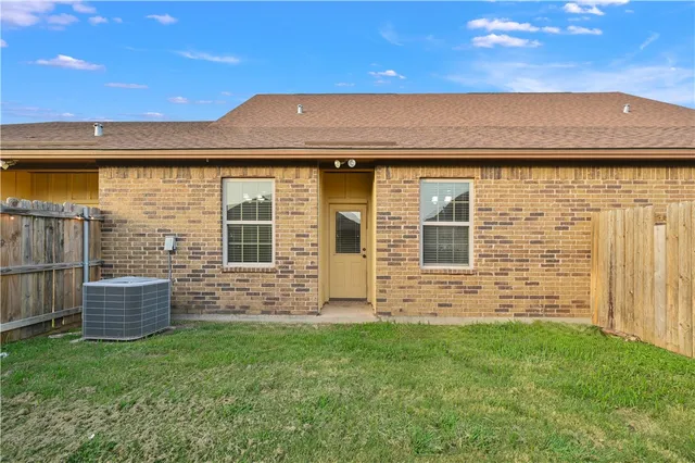 a front view of a house with brick walls