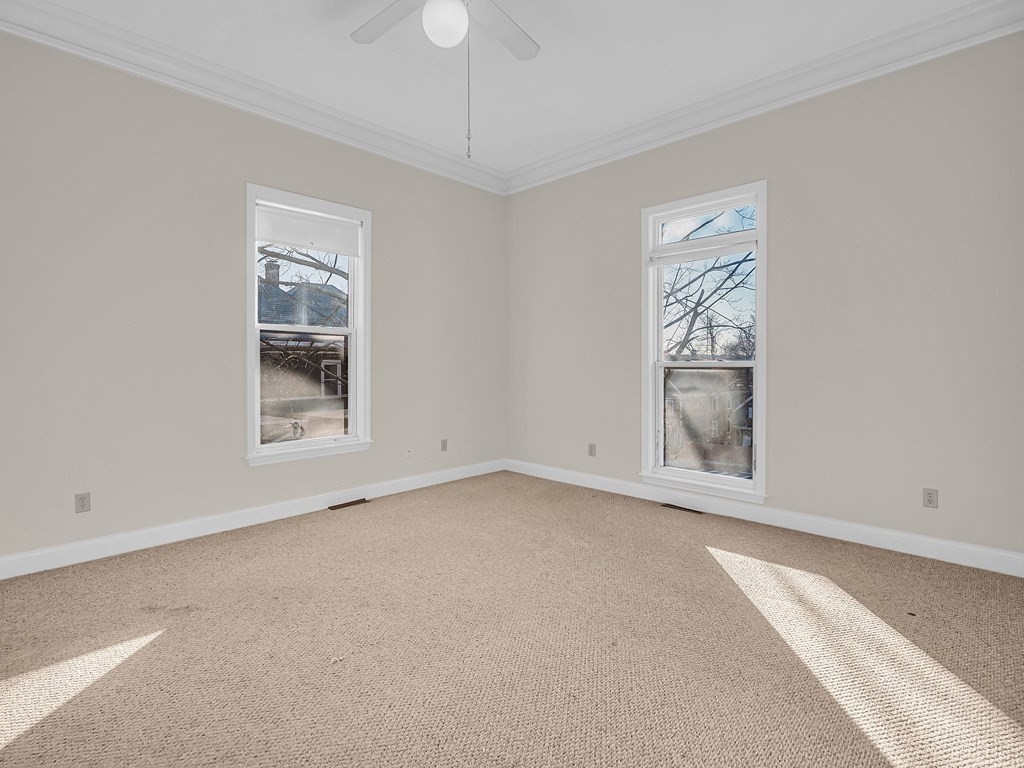 775 Bridge Street Lowell, MA 01850 - Photo 11 of 42 an empty room with windows