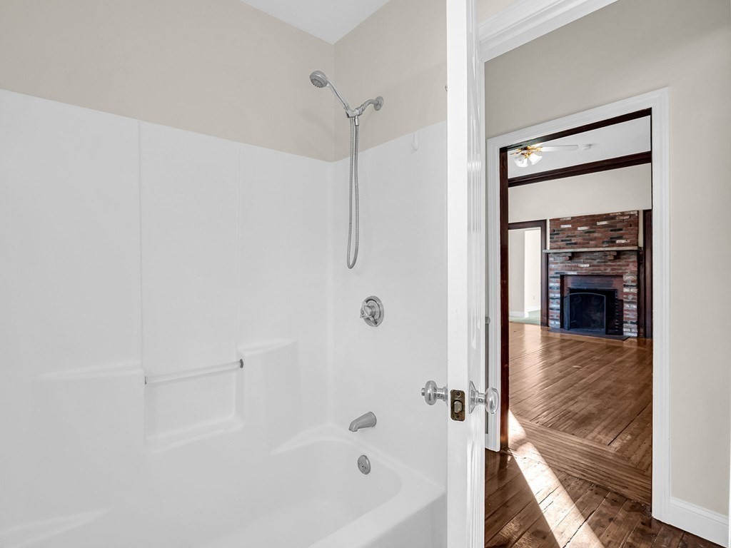 775 Bridge Street Lowell, MA 01850 - Photo 13 of 42 a bathroom with a bathtub and a shower