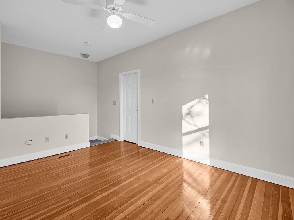 775 Bridge Street Lowell, MA 01850 - Photo 16 of 42 a view of empty room with wooden floor