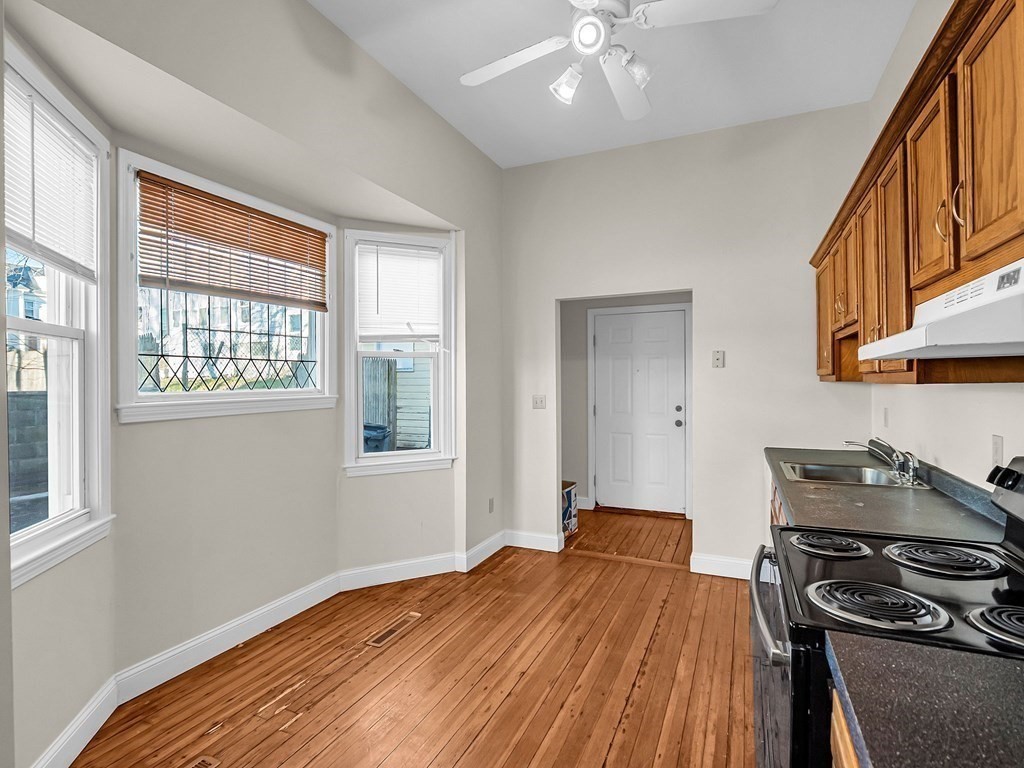 775 Bridge Street Lowell, MA 01850 - Photo 21 of 42 a bedroom with a bed and a window