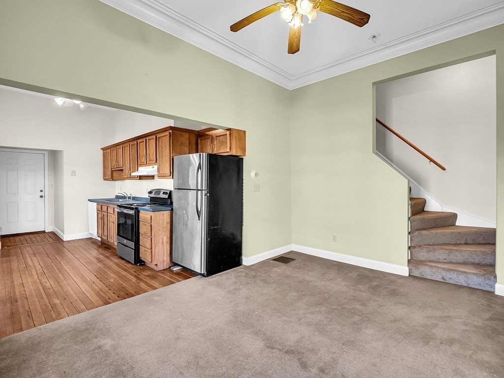 775 Bridge Street Lowell, MA 01850 - Photo 22 of 42 a view of a kitchen with a stove cabinets and entryway