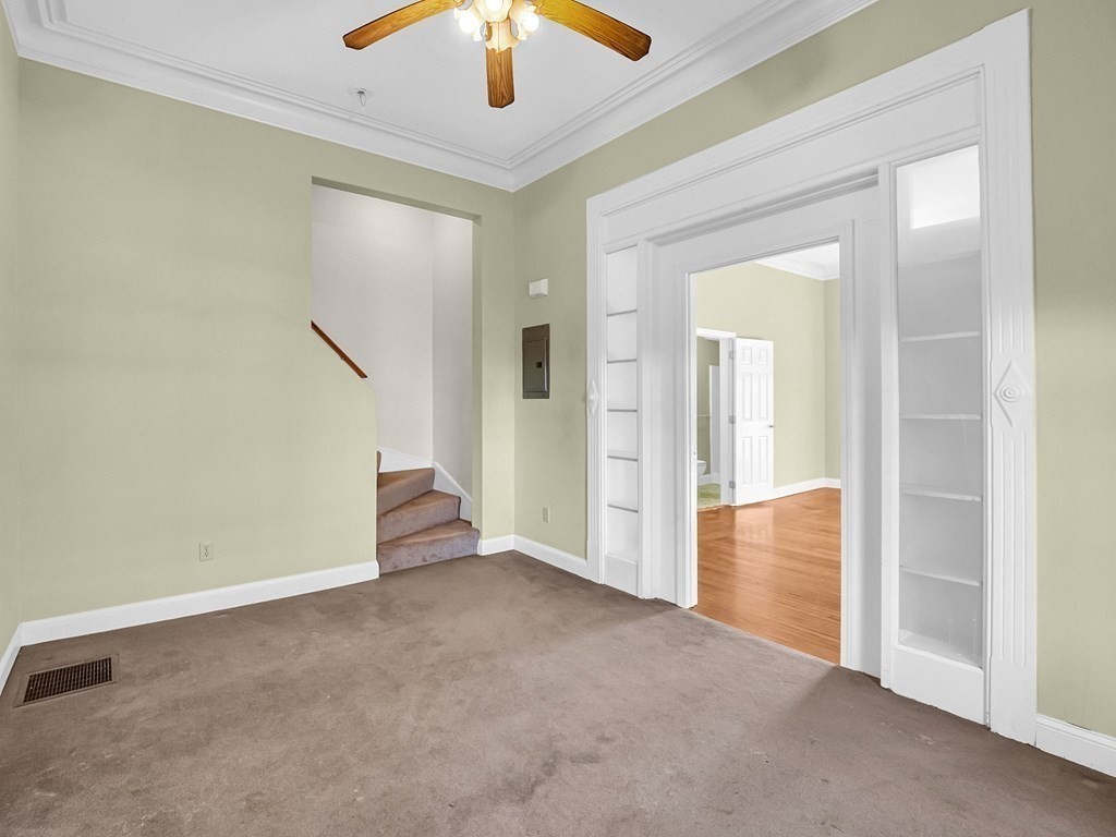 775 Bridge Street Lowell, MA 01850 - Photo 23 of 42 an empty room with closet and a chandelier fan