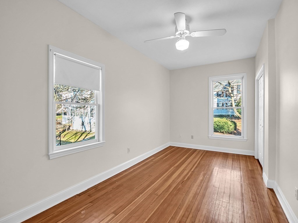 775 Bridge Street Lowell, MA 01850 - Photo 31 of 42 wooden floor in an empty room with a window