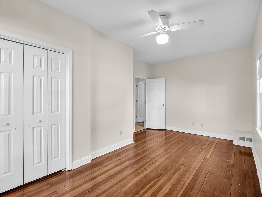 775 Bridge Street Lowell, MA 01850 - Photo 33 of 42 a view of an empty room with wooden floor