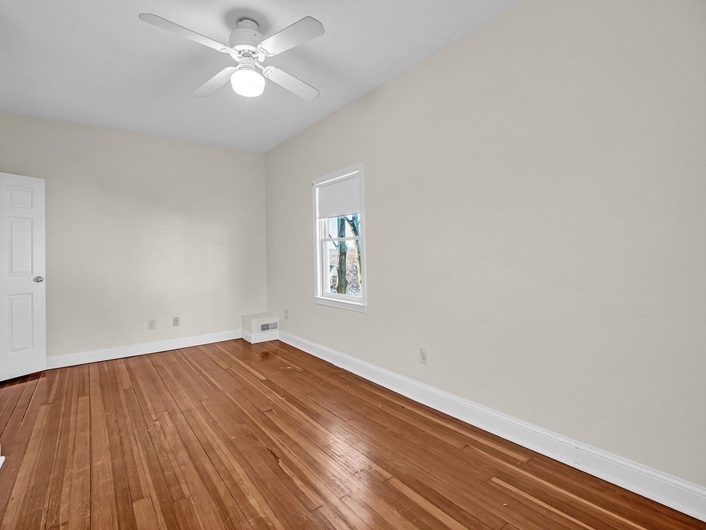 775 Bridge Street Lowell, MA 01850 - Photo 34 of 42 wooden floor in an empty room with a window