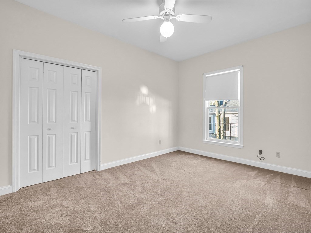 775 Bridge Street Lowell, MA 01850 - Photo 37 of 42 an empty room with windows and fan