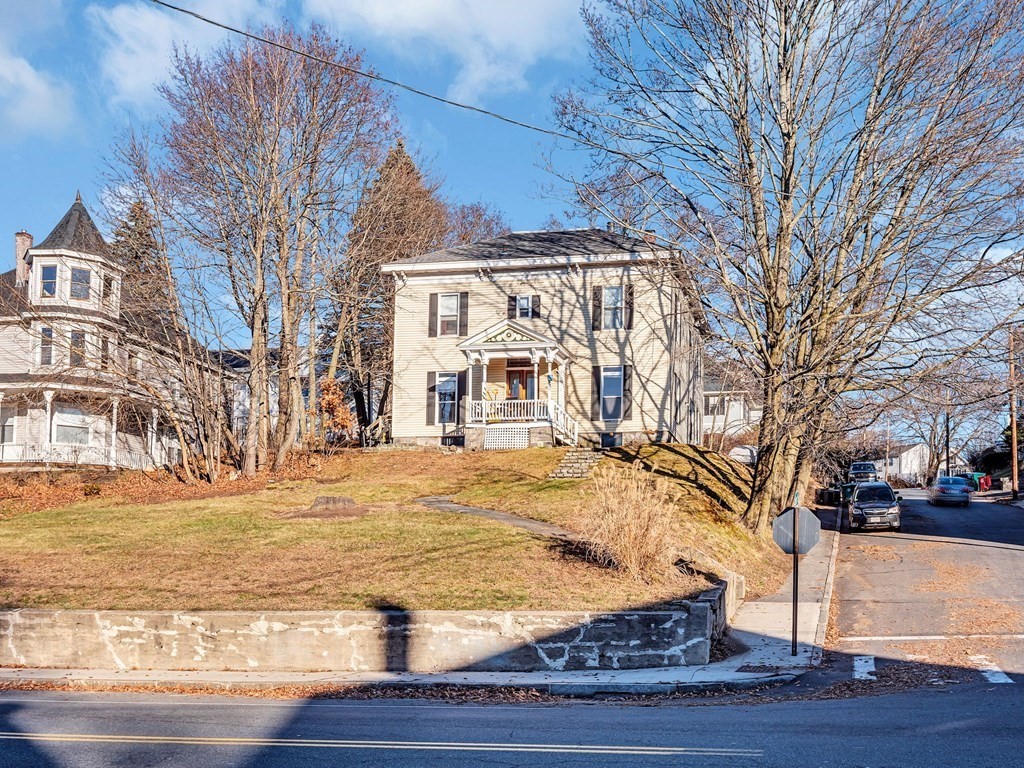 775 Bridge Street Lowell, MA 01850 - Photo 42 of 42 a front view of a house with a yard