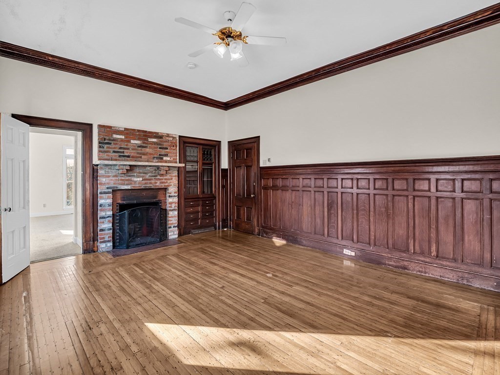 775 Bridge Street Lowell, MA 01850 - Photo 8 of 42 a view of a livingroom with a fireplace