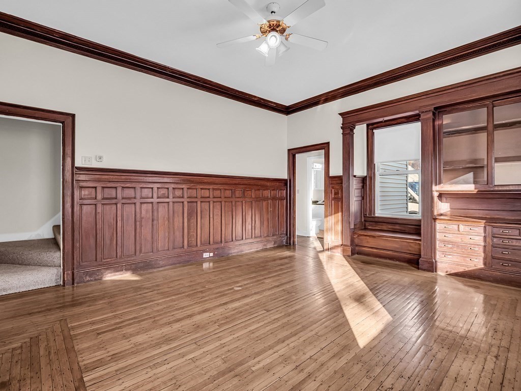 775 Bridge Street Lowell, MA 01850 - Photo 9 of 42 a view of a room with wooden floor and stairs
