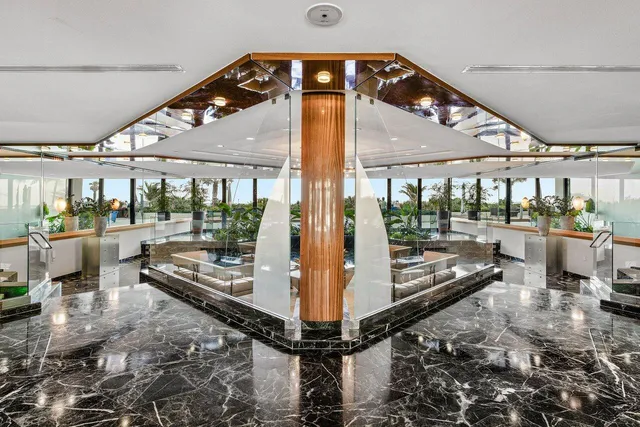 a view of a living room with a floor to ceiling window and floor