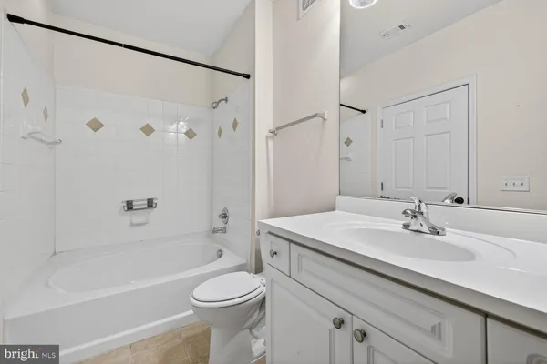 a bathroom with a sink a toilet and a bathtub