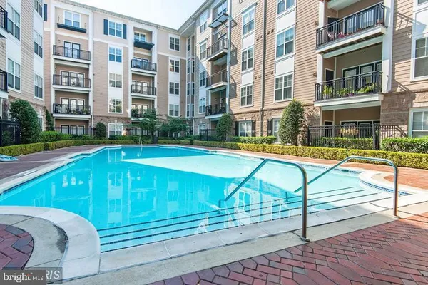 a view of a swimming pool with a lounge chairs