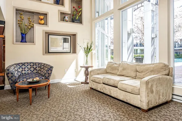 a living room with furniture and a large window