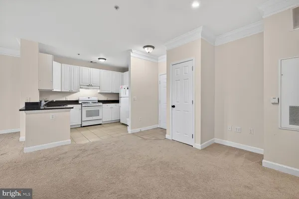 a view of kitchen with cabinets and stainless steel appliances