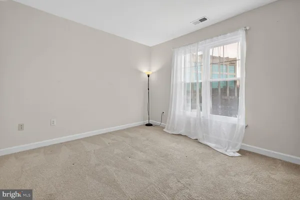 an empty room with a empty space and window