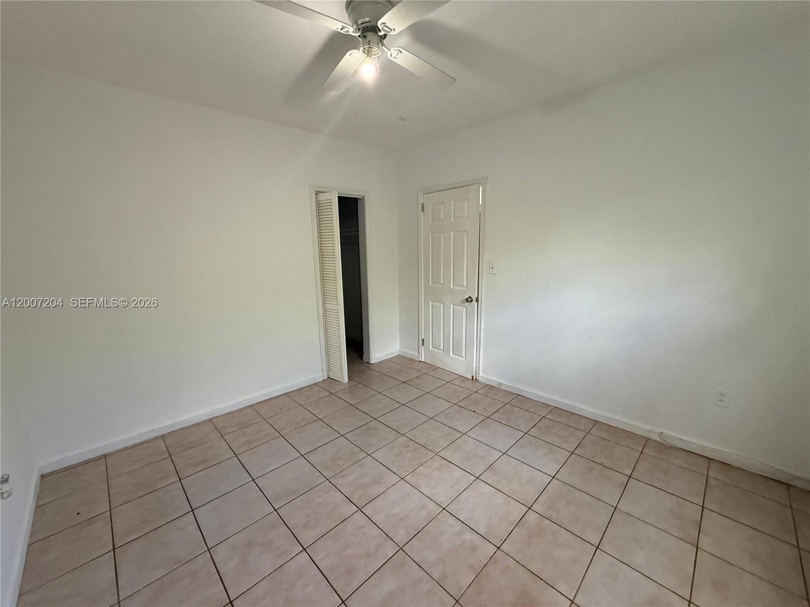 2483 Southwest 11th Street, Unit 2483 Miami, FL 33135 - Photo 12 of 12 a view of an empty room and window