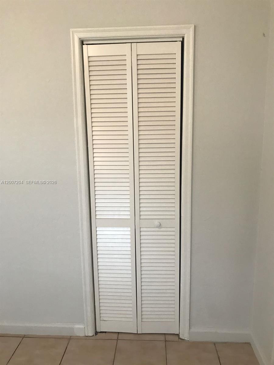 2483 Southwest 11th Street, Unit 2483 Miami, FL 33135 - Photo 6 of 12 an empty room with windows