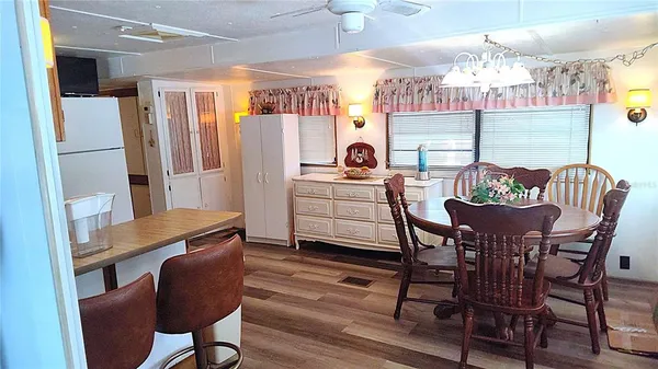 a dining room with furniture and window