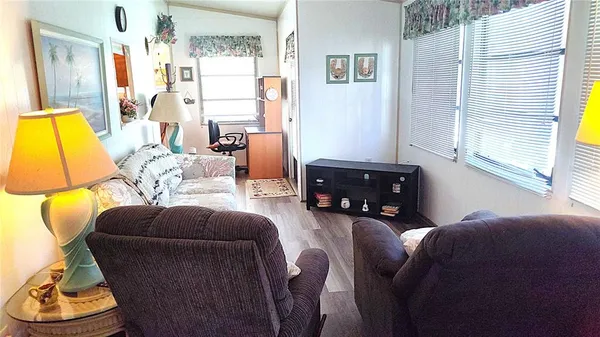 a living room with furniture and a window