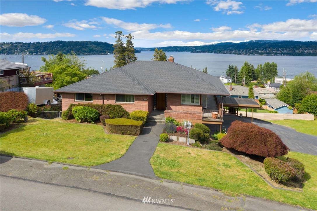 7724 South Sunnycrest Road Seattle, WA 98178 - Photo 1 of 21 an outdoor space with furniture and a garden