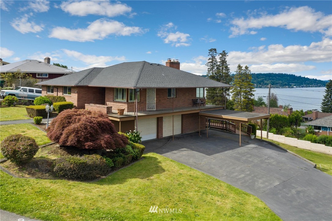 7724 South Sunnycrest Road Seattle, WA 98178 - Photo 2 of 21 a front view of a house with a garden and plants