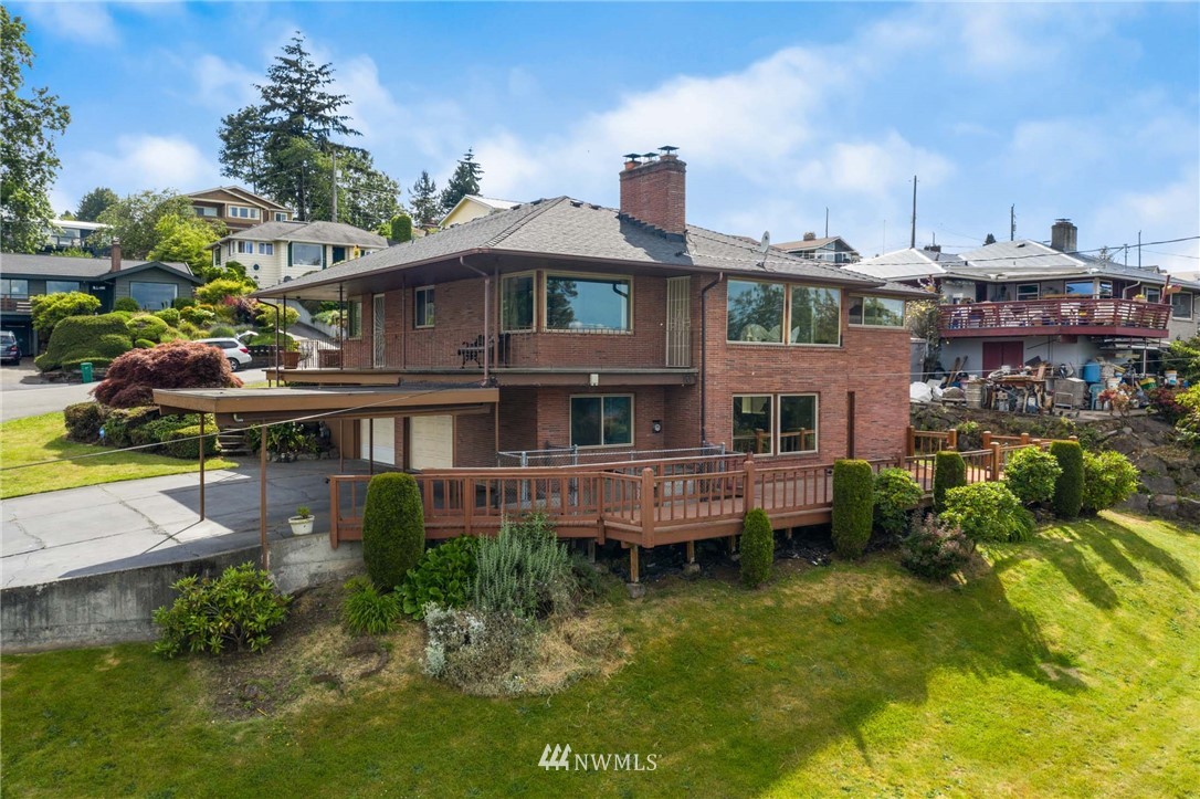 7724 South Sunnycrest Road Seattle, WA 98178 - Photo 3 of 21 a view of houses with swimming pool yard and outdoor seating