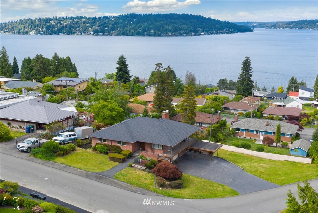 7724 South Sunnycrest Road Seattle, WA 98178 - Photo 4 of 21 a aerial view of a house with outdoor space and lake view