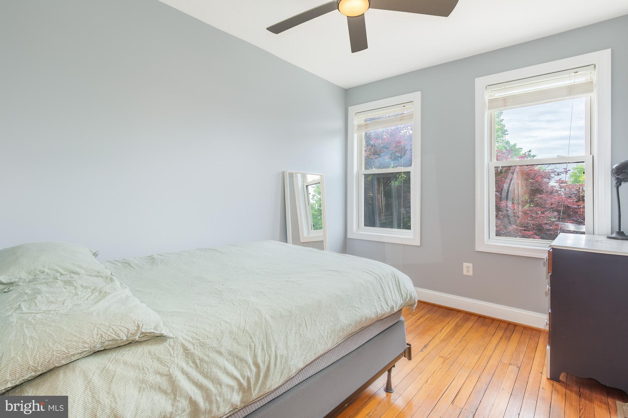116 V Street Northeast Washington, DC 20002 - Photo 14 of 26 a bedroom with a bed and a window