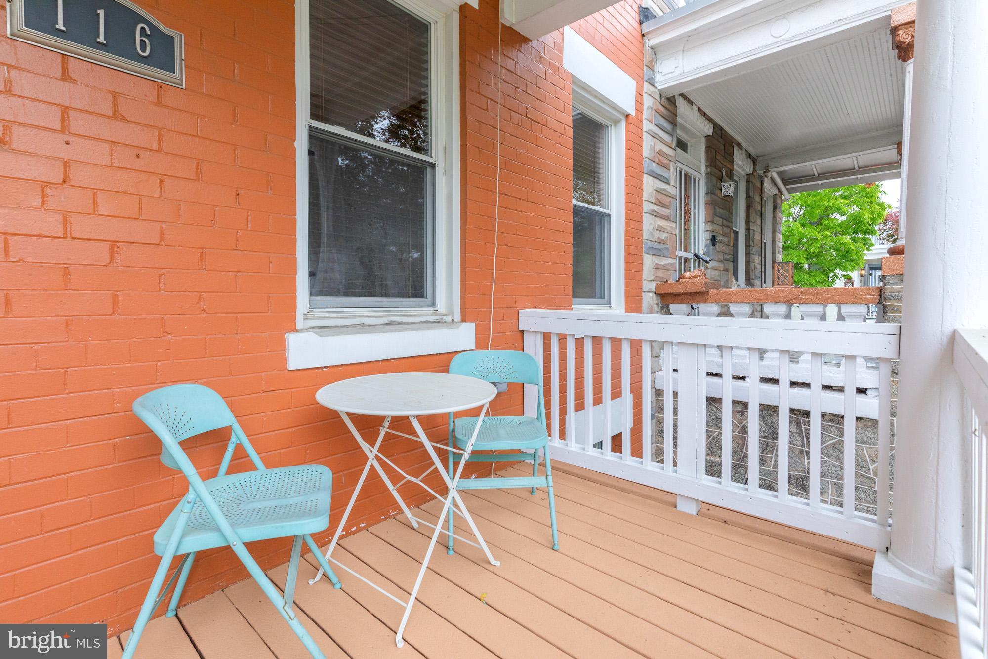 116 V Street Northeast Washington, DC 20002 - Photo 2 of 26 a view of a chair and table on the deck