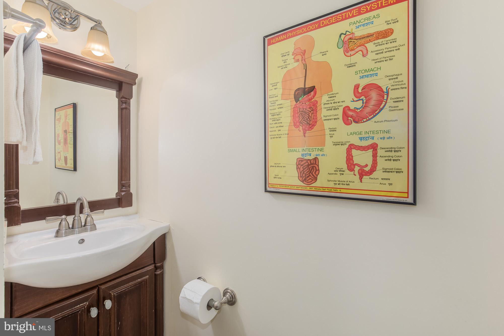 116 V Street Northeast Washington, DC 20002 - Photo 22 of 26 a bathroom with a sink and a mirror