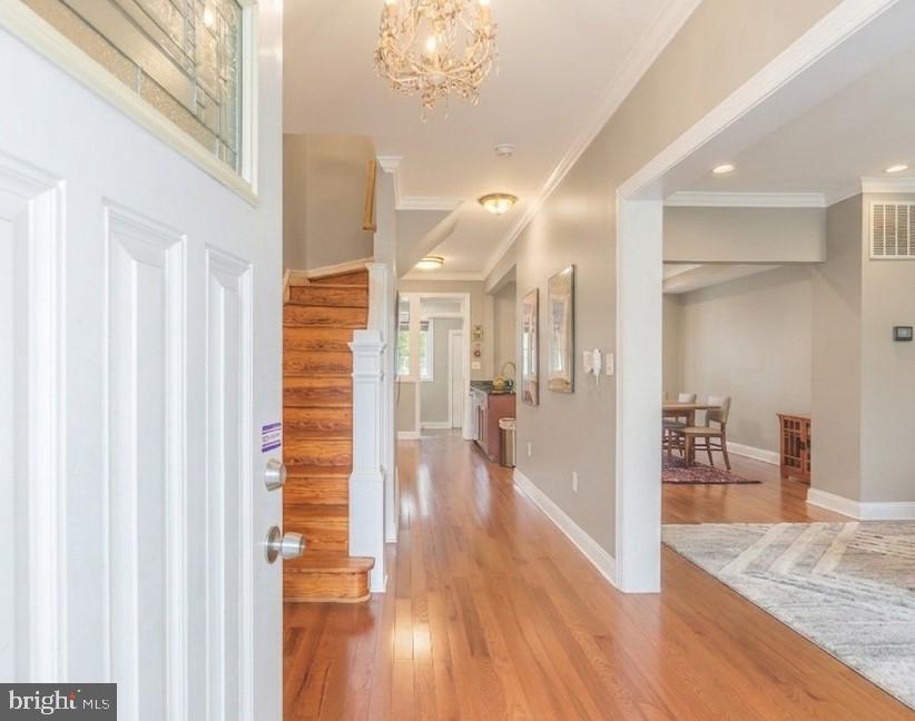 116 V Street Northeast Washington, DC 20002 - Photo 3 of 26 a view of a hallway view with wooden floor and staircase