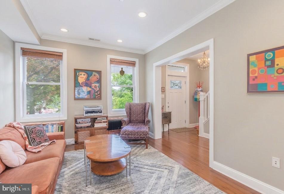 116 V Street Northeast Washington, DC 20002 - Photo 4 of 26 a living room with furniture and a large window