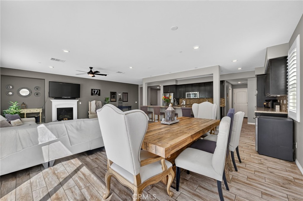 23347 Crystal Way Wildomar, CA 92595 - Photo 27 of 109 a view of a dining room with furniture window and wooden floor