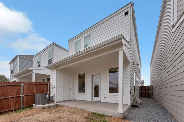 a view of a house with wooden walls and stairs