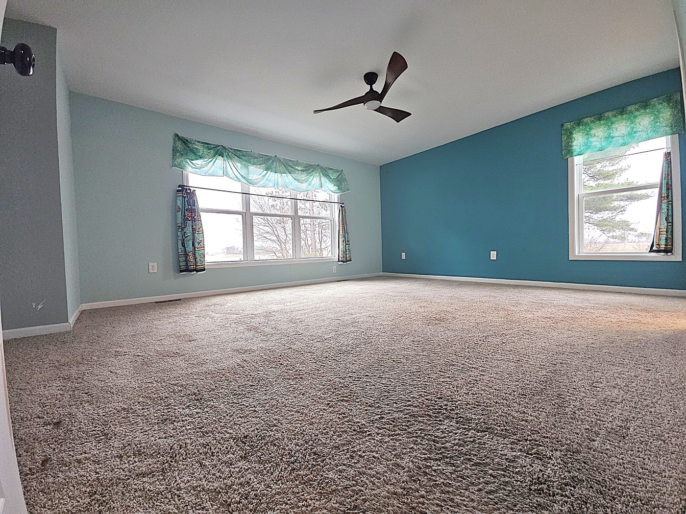 809 McCoy Road Amboy, IL 61310 - Photo 12 of 58 a view of a livingroom with a ceiling fan and window