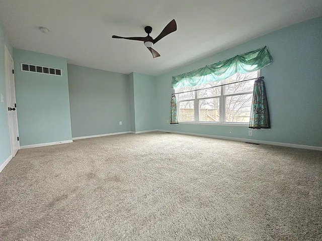 a bathroom with a sink mirror and toilet