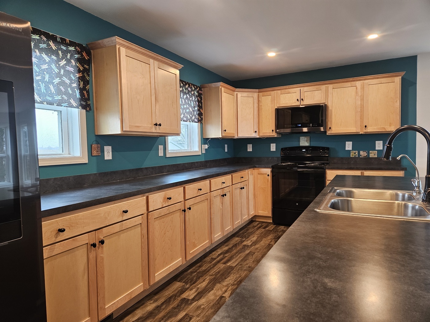 809 McCoy Road Amboy, IL 61310 - Photo 2 of 58 a kitchen with stainless steel appliances granite countertop a sink a stove cabinets counter space and a window