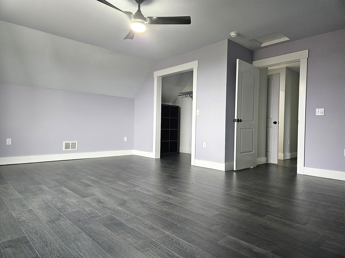 809 McCoy Road Amboy, IL 61310 - Photo 23 of 58 an empty room with wooden floor and ceiling fan