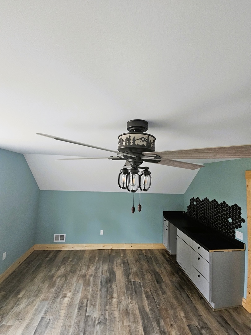 809 McCoy Road Amboy, IL 61310 - Photo 32 of 58 a view of a room with rack and wooden floor